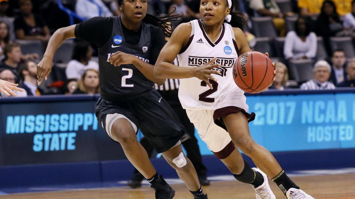 Mississippi State guard Morgan William drives past Washington guard Aarion McDonald, left, during the regional semifinal. The Bulldogs face Baylor in the Elite Eight Sunday night.