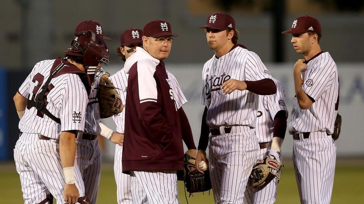 Former Mississippi State head coach Gary Henderson talks to his team on the mound on March 14, 2018, at MGM Park in Biloxi.