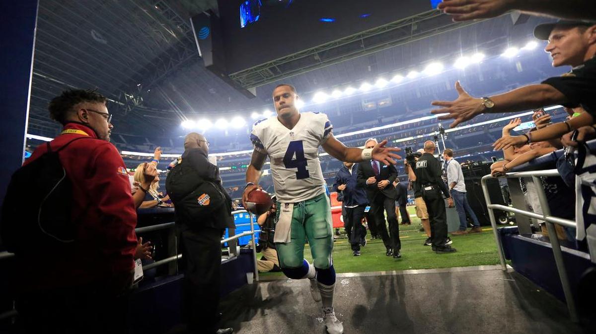 Dallas Cowboys quarterback Dak Prescott (4) leaves the field and heads to the locker room after their NFL football game against the Chicago Bears on Sunday in Arlington, Texas.
