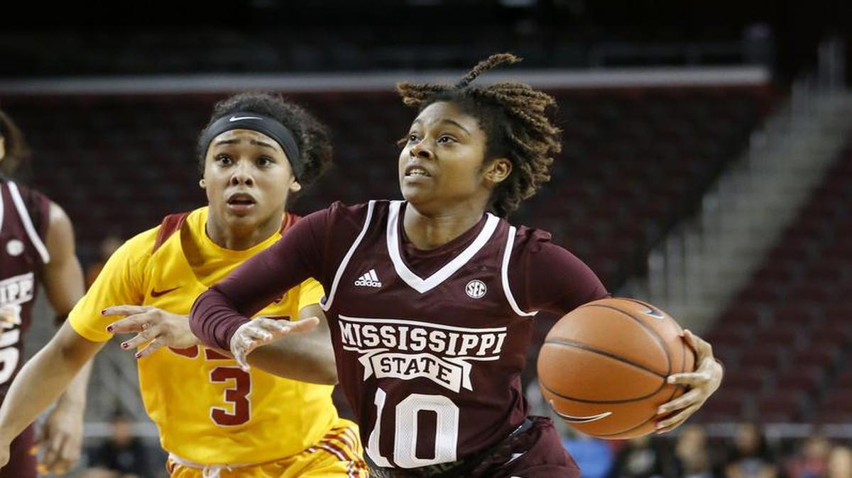 Mississippi State's Jazzmun Holmes, formerly of Harrison Central, drives to the basket against Southern California's Minyon Moore.
