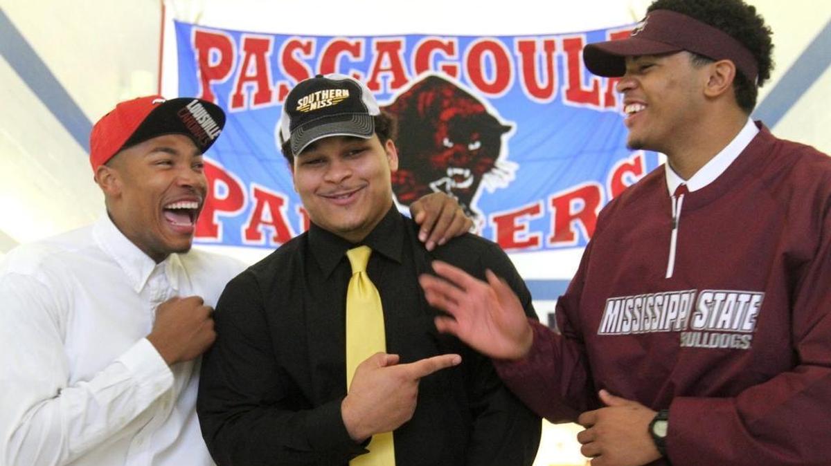 Pascagoula High School’s Jaylen Smith, Jauan Collins and Keith Joseph Jr. goof off while taking photos after they signed their letters of intent on Feb. 4, 2015. Smith is in junior year at Louisville and wearing No. 9 in honor of Joseph, who died in a car wreck in November of 2015.