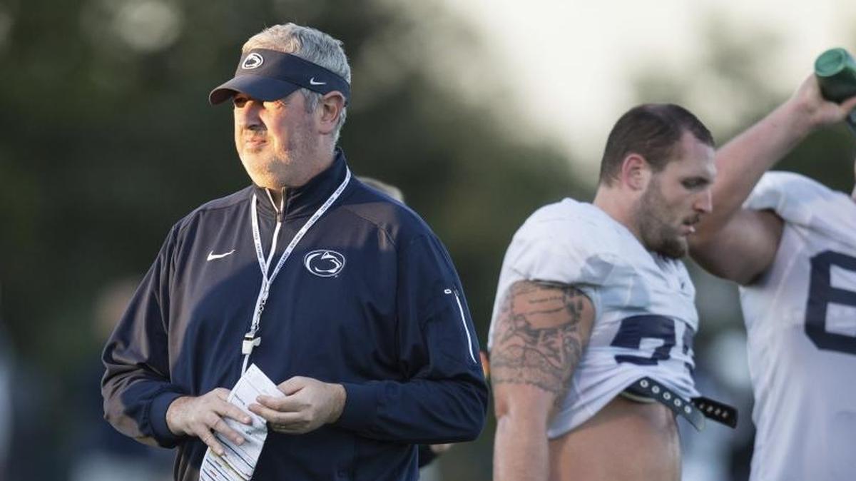 In this Oct. 5, 2016, file photo, Penn State offensive coordinator Joe Moorhead looks on during NCAA college football practice in State College, Pa. Moorhead was a successful FCS head coach at Fordham before being lured to Happy Valley by James Franklin. His first season with Penn State was a rousing success. According to multiple reports Moorhead has been hired at Mississippi State to lead its football program. He replaces Dan Mullen, who was recently hired by Florida.