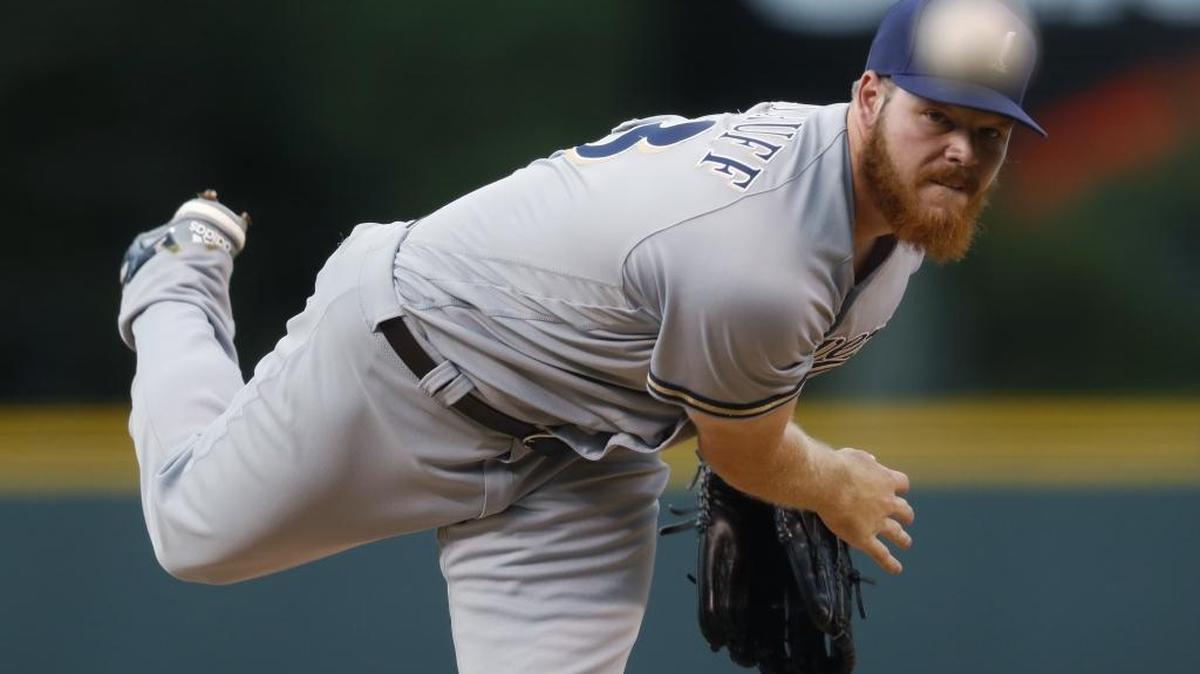 Milwaukee Brewers starting pitcher Brandon Woodruff delivers to Colorado Rockies' Charlie Blackmon on Aug. 19 in Denver.