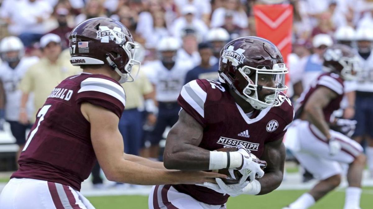 Mississippi State quarterback Nick Fitzgerald, left hands the ball off to running back Aeris Williams, right against Charleston Southern in Starkville, Miss.