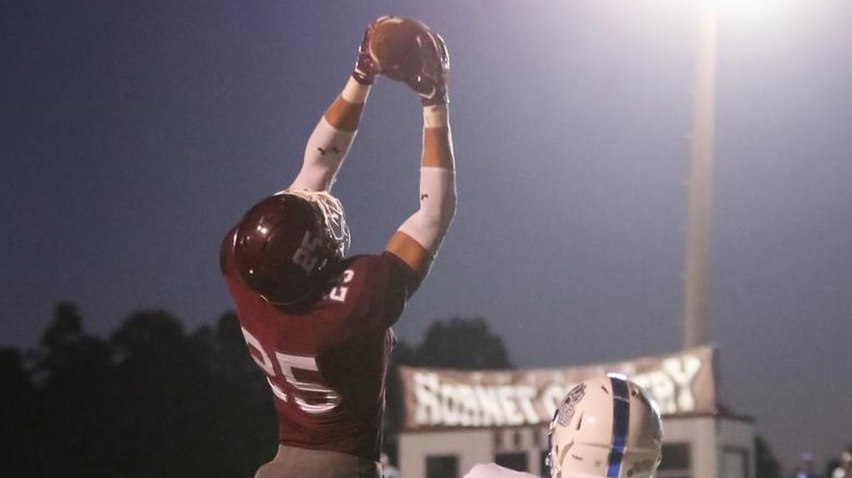 East Central wide receiver Brad Cumbest makes the catch in the end zone for a touchdown while guarded by Jefferson Davis County's Ronald Baker on Sept. 8 at East Central High in Hurley.
