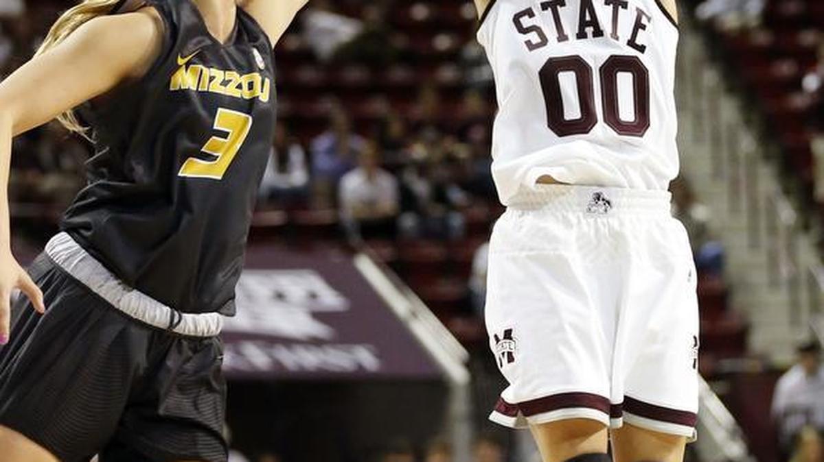 Mississippi State guard Dominique Dillingham (00) shoots a three-point basket past Missouri guard Sophie Cunningham (3).