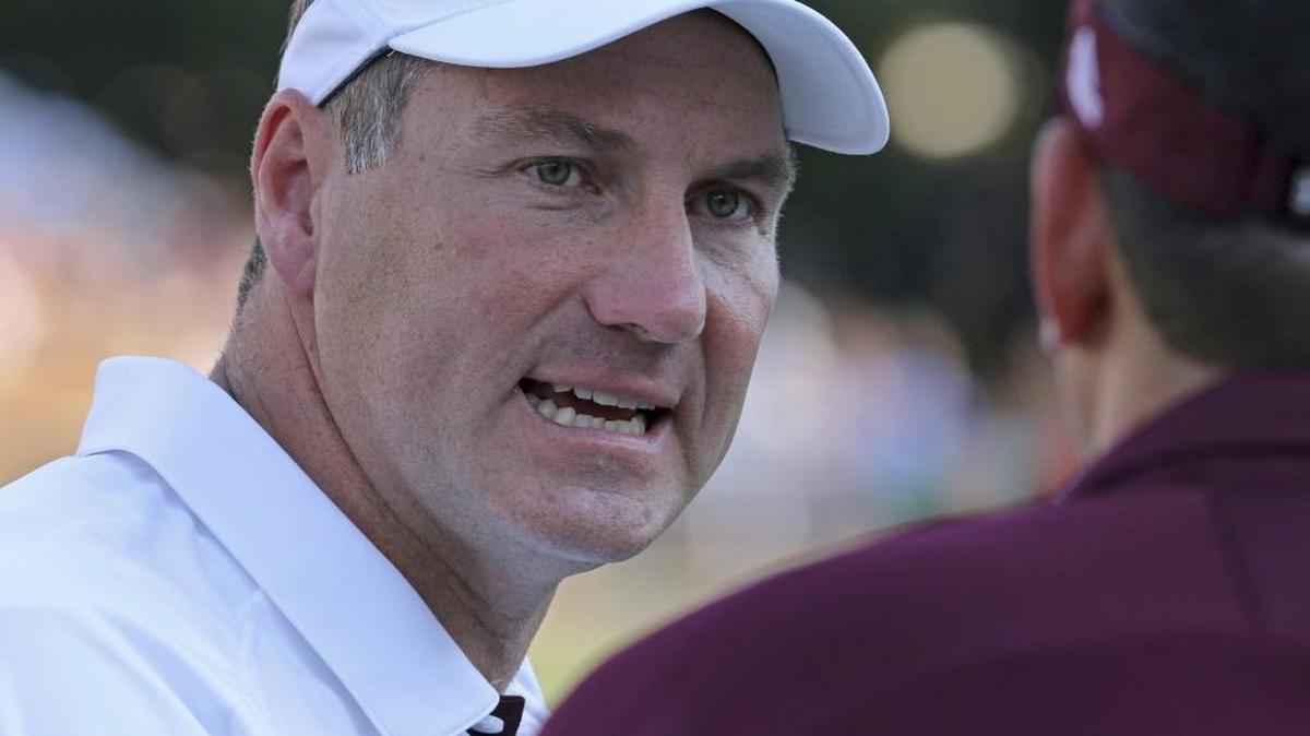 Mississippi State coach Dan Mullen talks to a staff member during the first half of their game against Charleston Southern in Starkville Saturday.