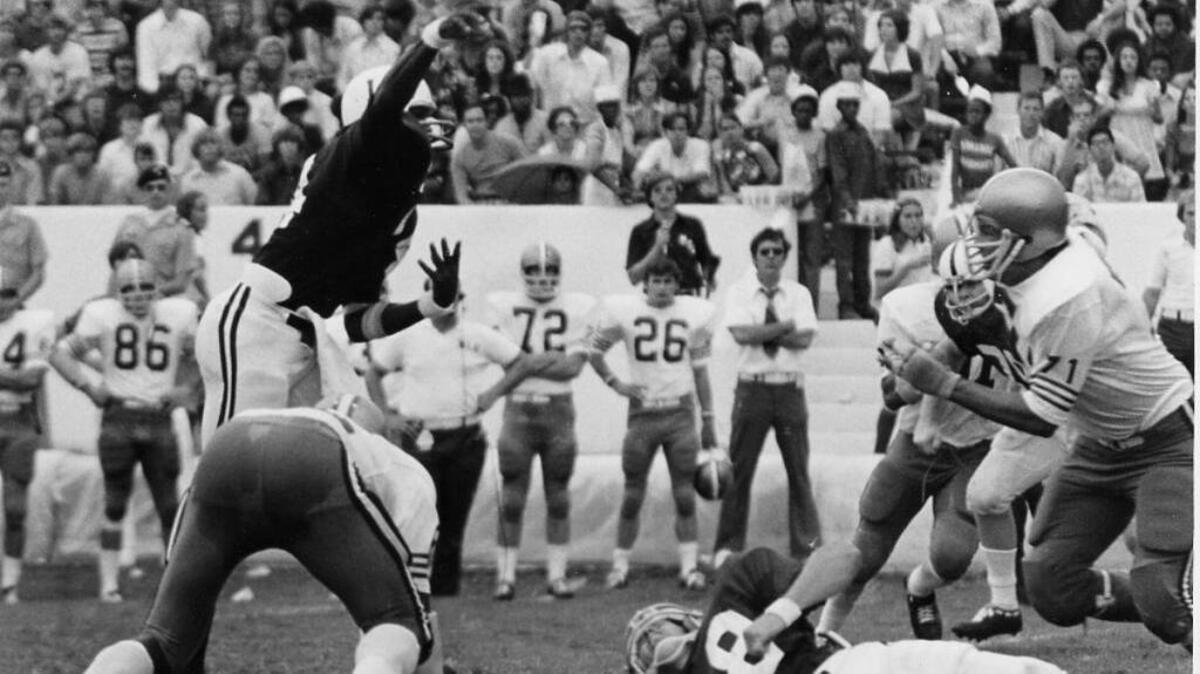 Melvin Barkum, pictured here throwing the football, became the first black quarterback to start a game at Mississippi State. Barkum was also a Gulfport High School standout.