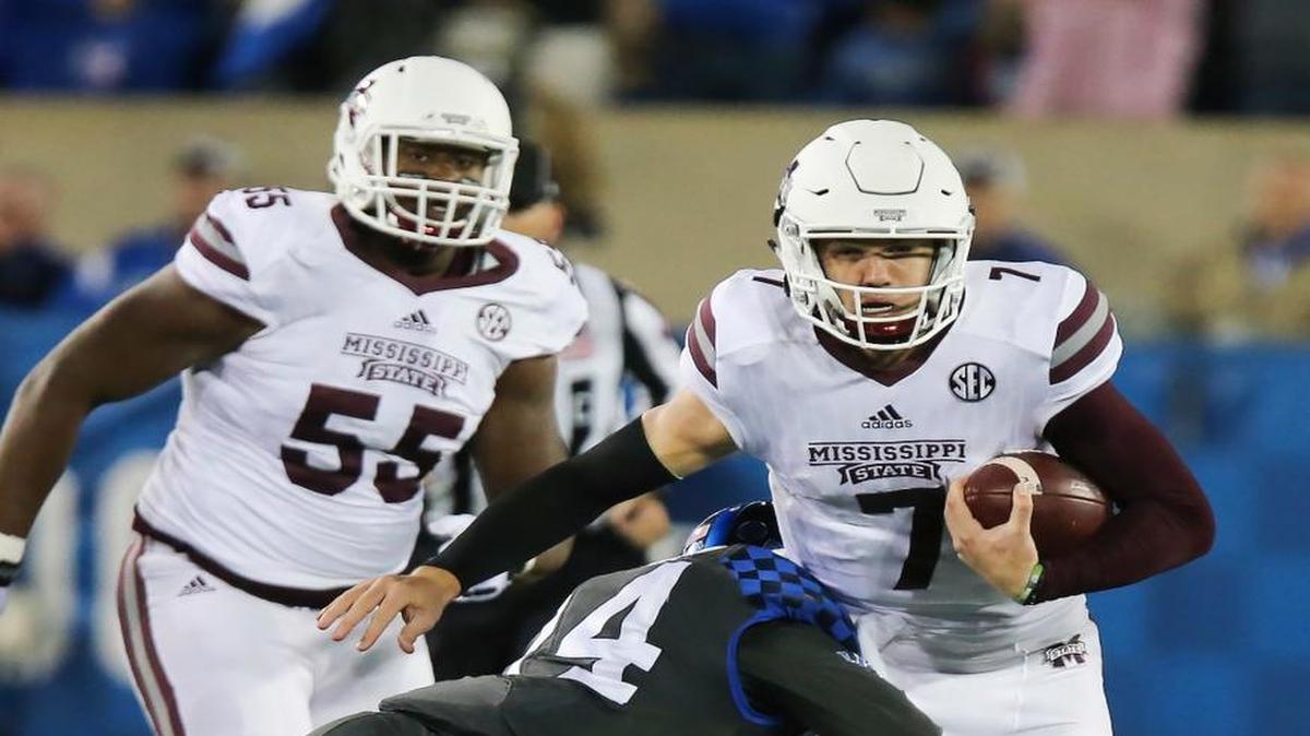 Mississippi State quarterback Nick Fitzgerald is tackled by Kentucky defensive back Blake McClain.