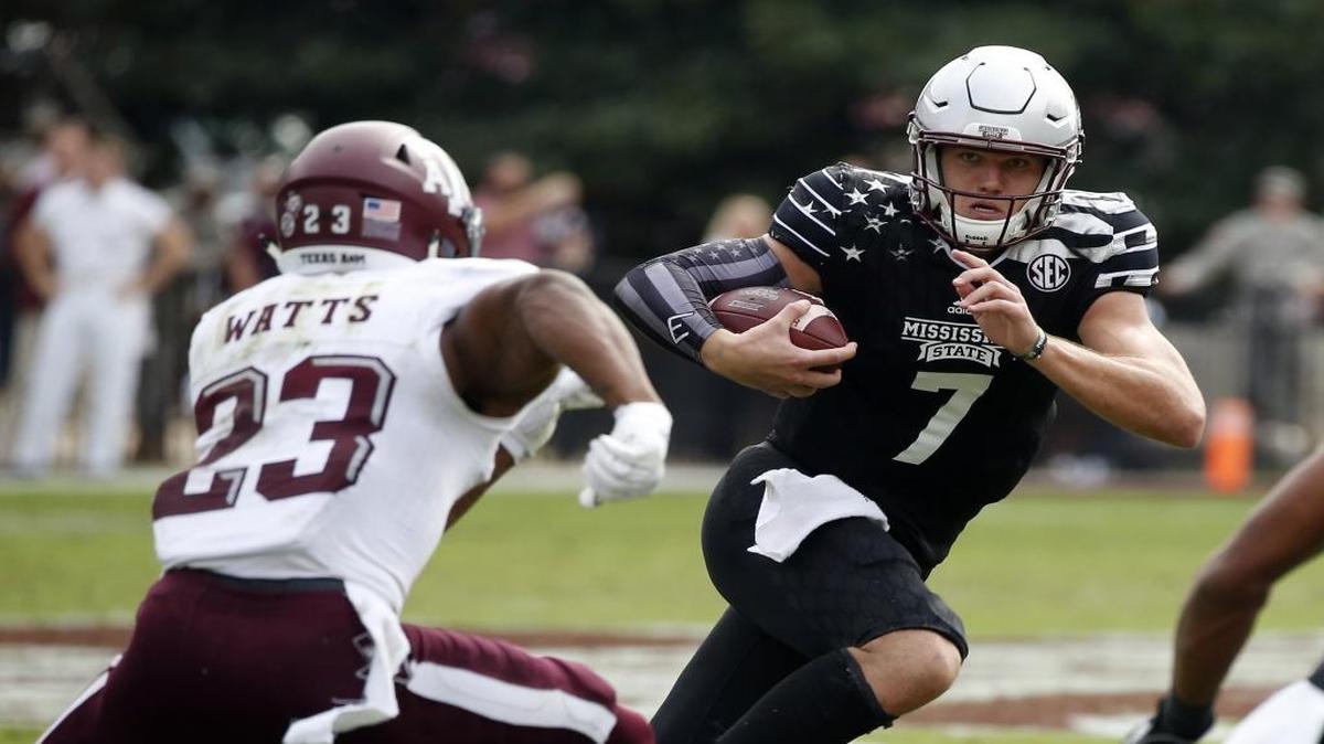 Mississippi State quarterback Nick Fitzgerald (7) runs past Texas A&M defensive back Armani Watts (23) for a first down on Nov. 5 in Starkville.