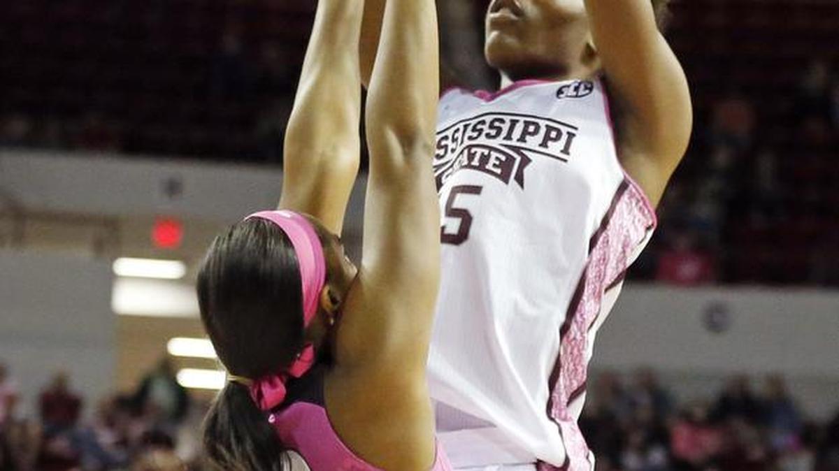 Mississippi State center Teaira McCowan (15) shoots over Georgia forward Halle Washington (23).