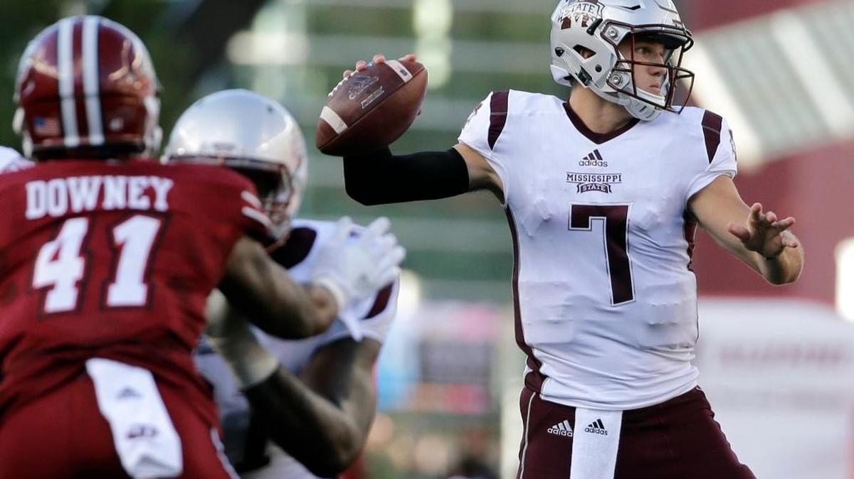 Mississippi State quarterback Nick Fitzgerald (7) passes the ball as Massachusetts linebacker Da'Sean Downey (41) is blocked Saturdayin Foxborough, Mass.