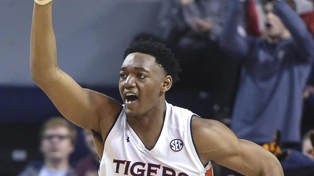 Auburn center Austin Wiley celebrates a dunk on Mississippi State during an NCAA college basketball game Tuesday, Feb. 7, 2017, in Auburn, Ala.