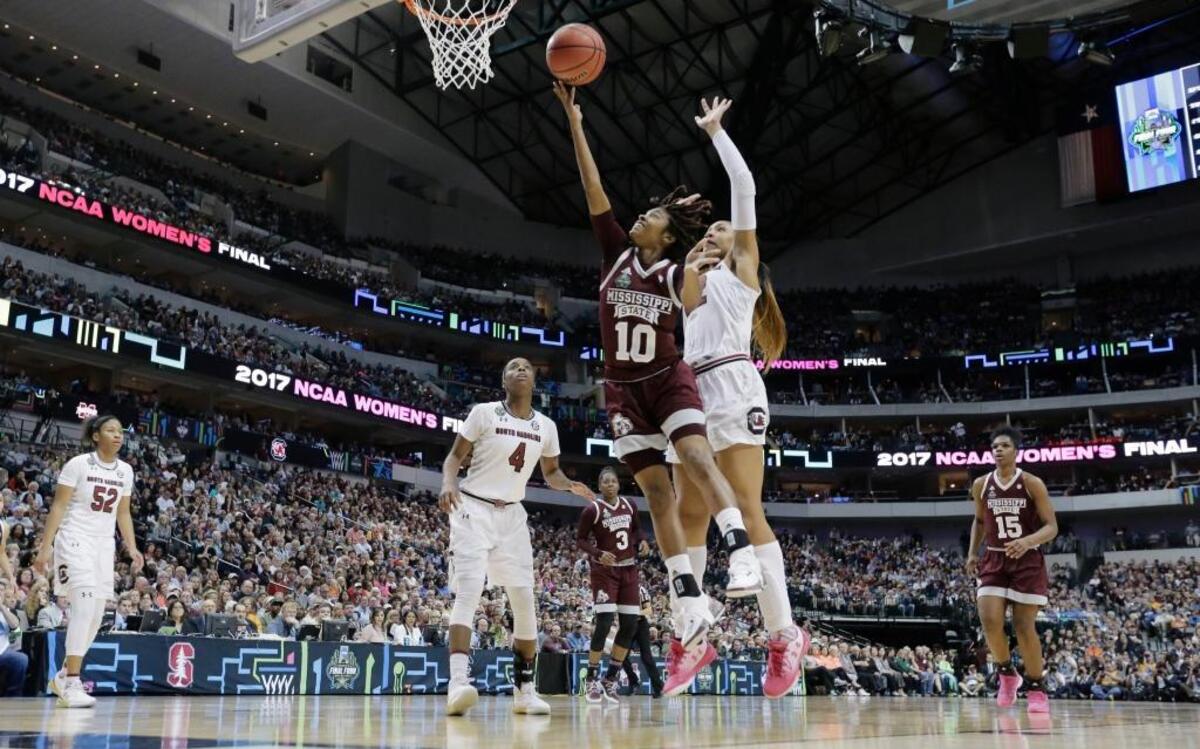 Mississippi State guard Jazzmun Holmes (10) drives to the basket past South Carolina forward A’ja Wilson (22) during the first half of Sunday’s National Championship game. Holmes prepped at Harrison Central.