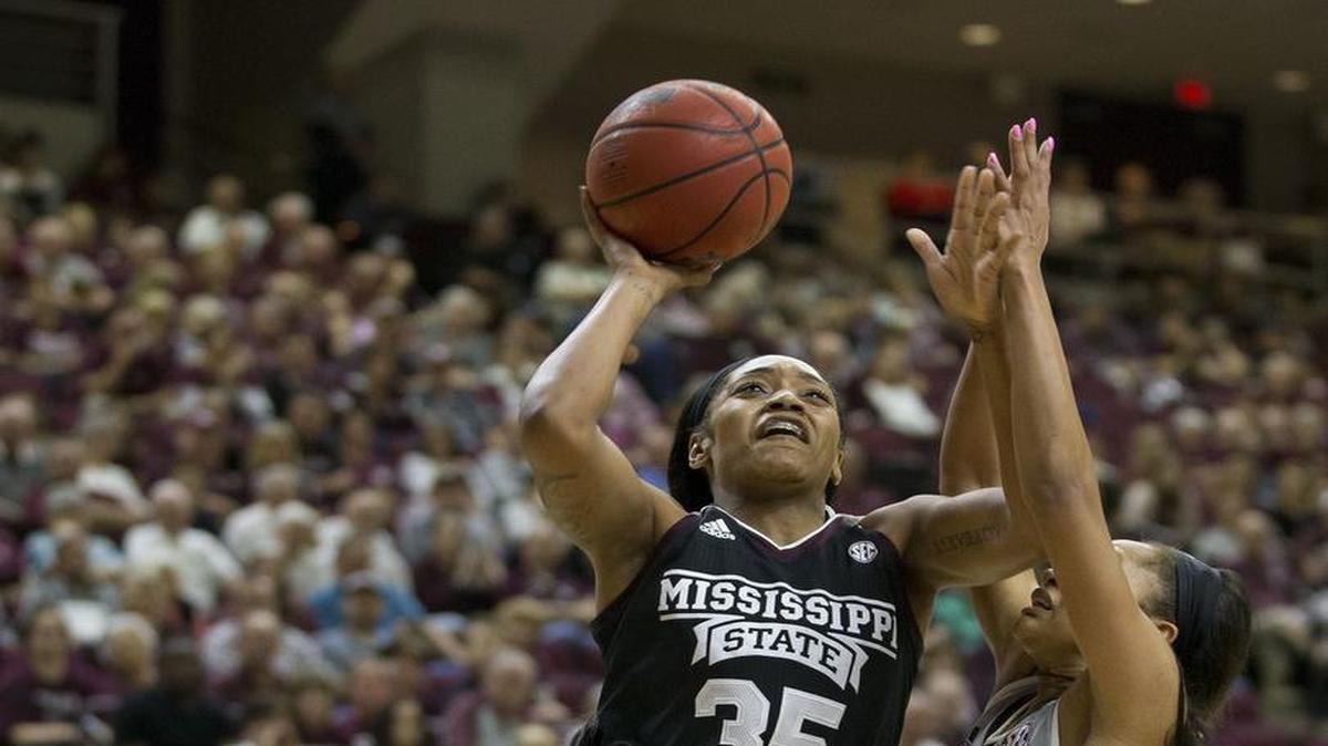 Mississippi State forward Victoria Vivians (35) shoots as Texas A&M guard Curtyce Knox (11) defends.