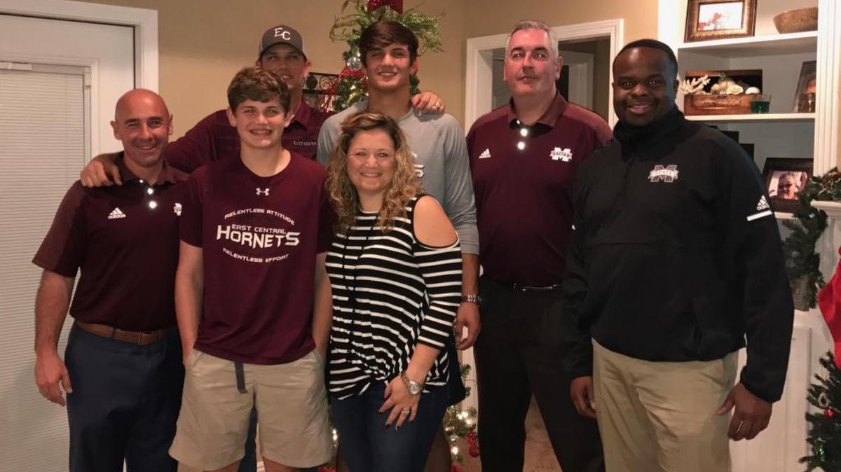 East Central senior tight end Brad Cumbest, center, received a visited from new Mississippi State head coach Joe Moorhead Sunday night. Moorhead is standing to the right of Cumbest.