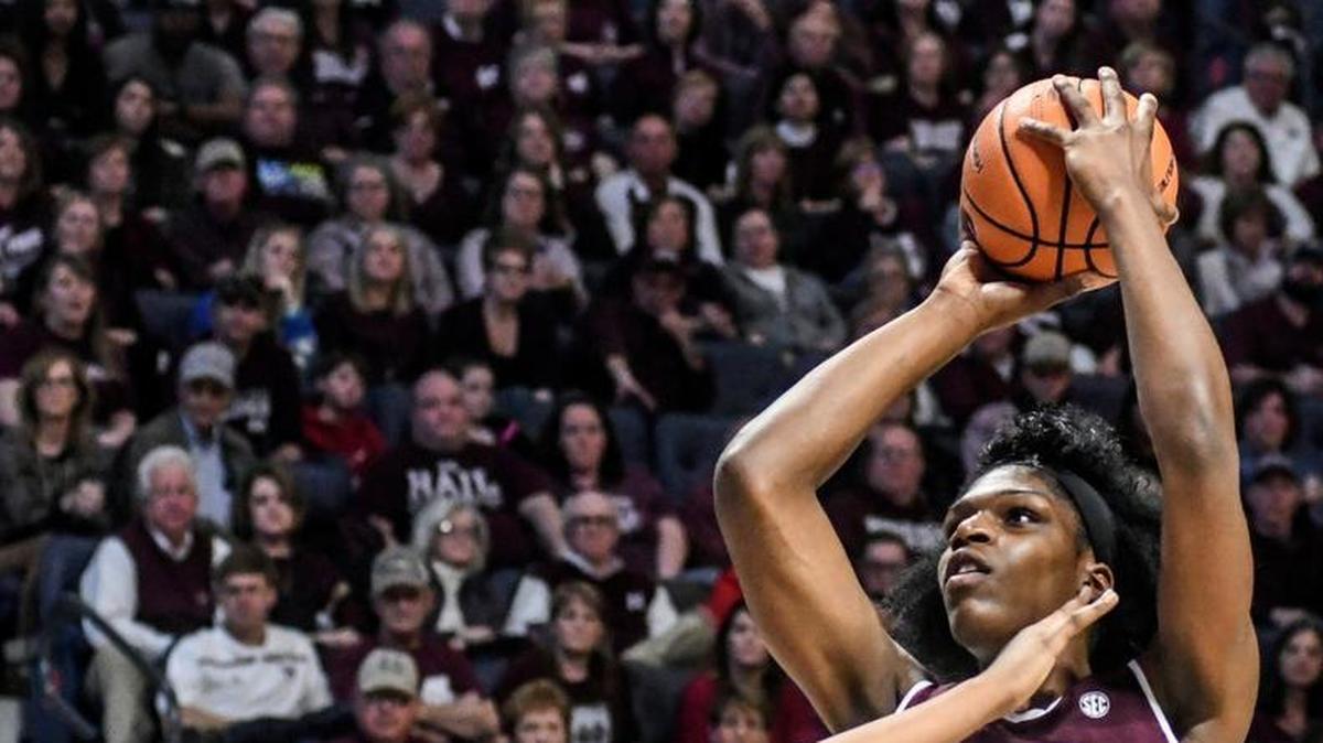 Mississippi State's Teaira McCowan (15) shoots against Ole Miss’ Promise Taylor (55).
