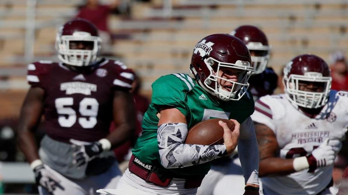 Maroon quarterback Nick Fitzgerald runs for a first down against the White team during the first half of Mississippi State's Maroon and White spring football game, Saturday.