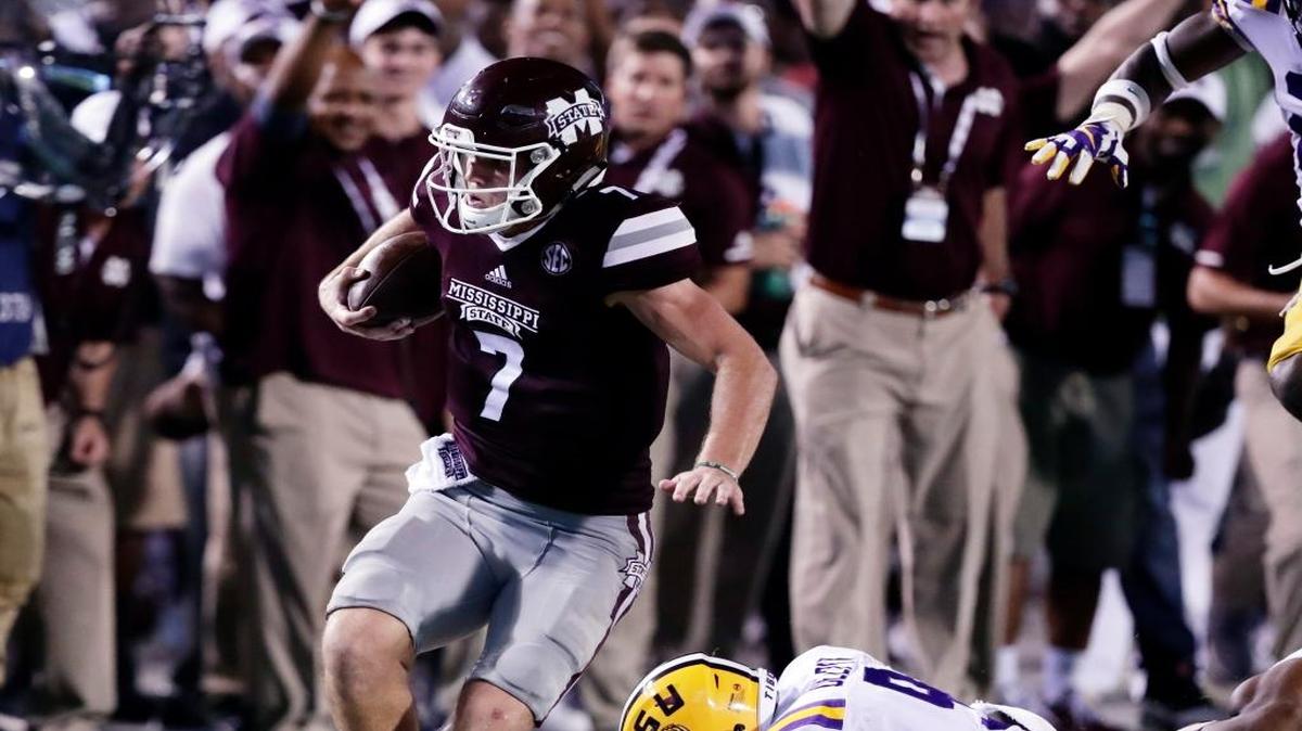Mississippi State quarterback Nick Fitzgerald (7) sprints past LSU safety Grant Delpit (9).
