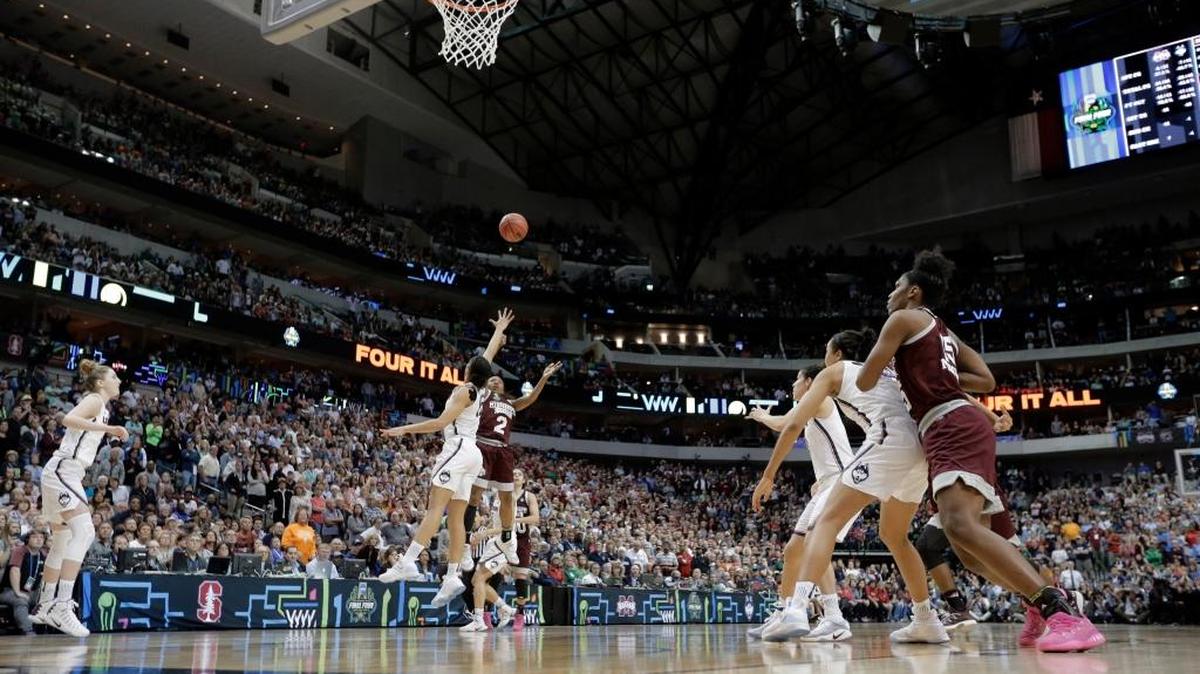 Mississippi State guard Morgan William (2) shoots a buzzer beater over Connecticut guard Gabby Williams (15) in the semifinals of the women's Final Four, Saturday in Dallas. Mississippi State won in overtime, 66-64.