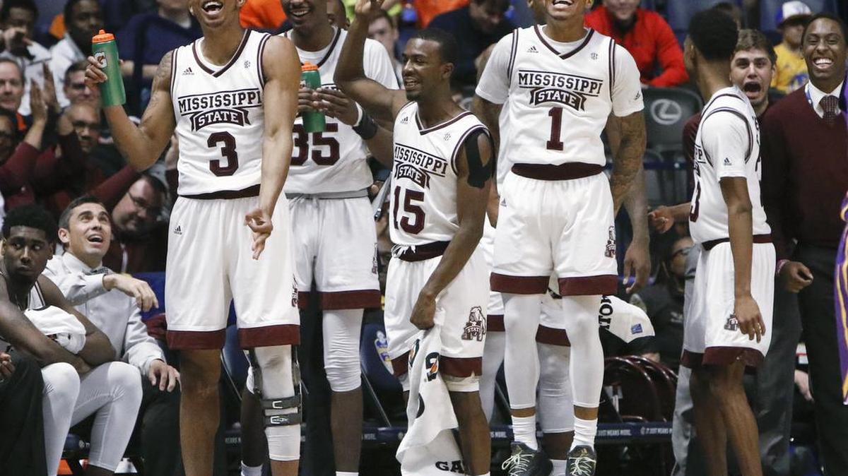 Mississippi State's Xavian Stapleton (3), Aric Holman (35), I.J. Ready (15) and Lamar Peters (1) celebrate after beating LSU 79-52 at the Southeastern Conference tournament Wednesday.
