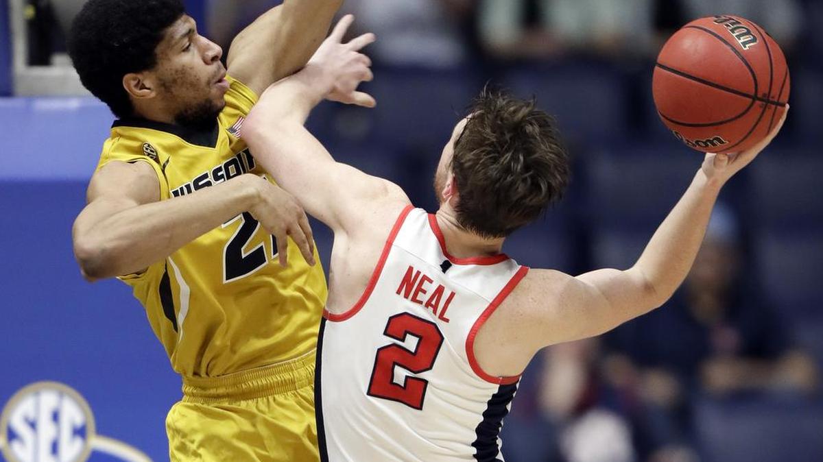 Ole Miss guard Cullen Neal (2) shoots against Missouri forward Jordan Barnett (21) during the second half of the SEC Tournament game on Thursday in Nashville, Tenn.