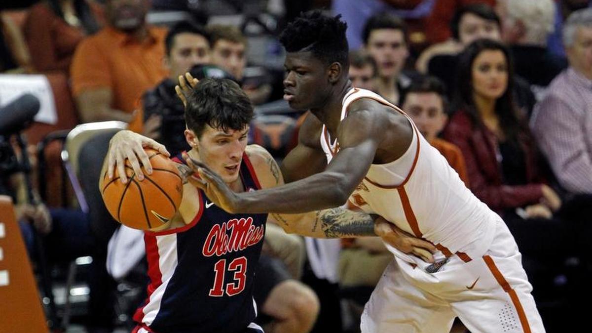 Texas center Mohamed Bamba, right, defends against Ole Miss center Dominik Olejniczak.