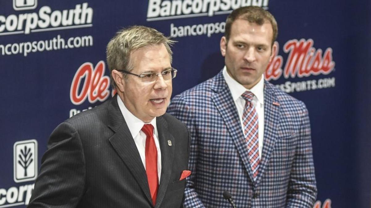 Ole Miss chancellor Jeff Vitter, left, speaks as athletic director Ross Bjork listens as the discuss NCAA sanctions leveled against the football program during a press conference at the Manning Center in Oxford, Miss., Friday, Dec. 1, 2017. The program was handed a two-year postseason ban and other penalties by the NCAA.