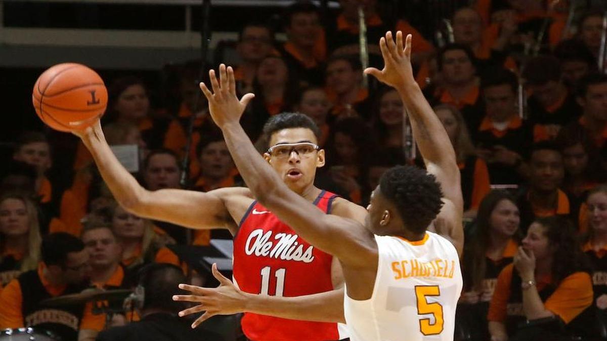 Ole Miss’ Sebastian Saiz (11) passes the ball against Tennessee's Admiral Schofield (5). The Rebels upset South Carolina 75-70 Saturday.