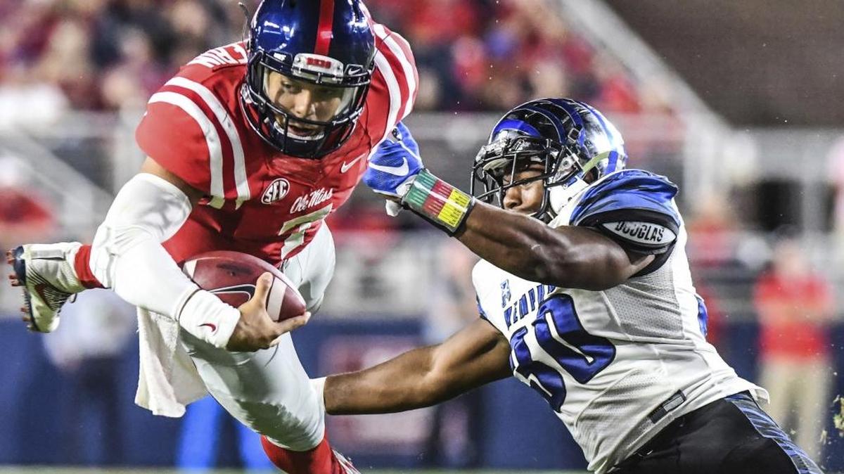 Ole Miss Jason Pellerin (7) dives for a first down as he is hit by Memphis linebacker Shareef White (30) during their 2016 game. With quarterback Shea Patterson out for the season, the Rebels have moved Pellerin back to quarterback.