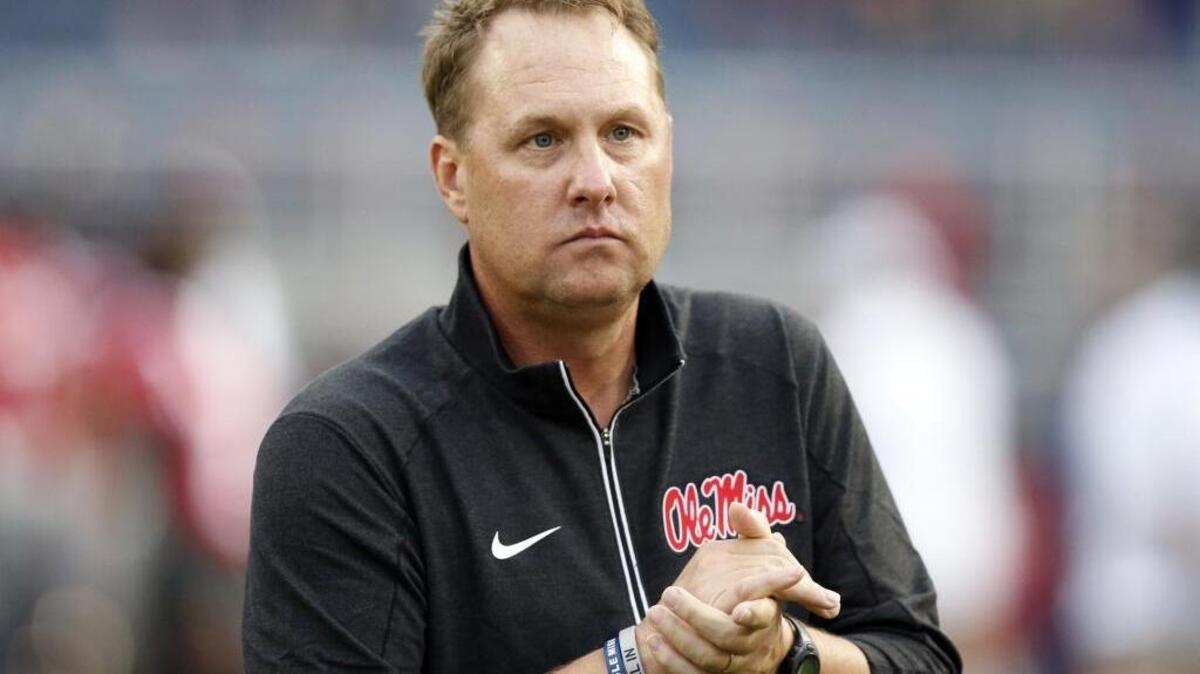 Ole Miss football coach Hugh Freeze watches his team warmup prior to playing Texas A&M in Oxford.