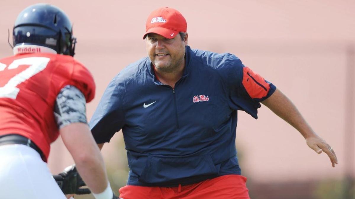 Ole Miss offensive line coach Matt Luke works on a drill with linemen during practice in Oxford last season. Luke was named the interim coach last week after Hugh Freeze resigned.