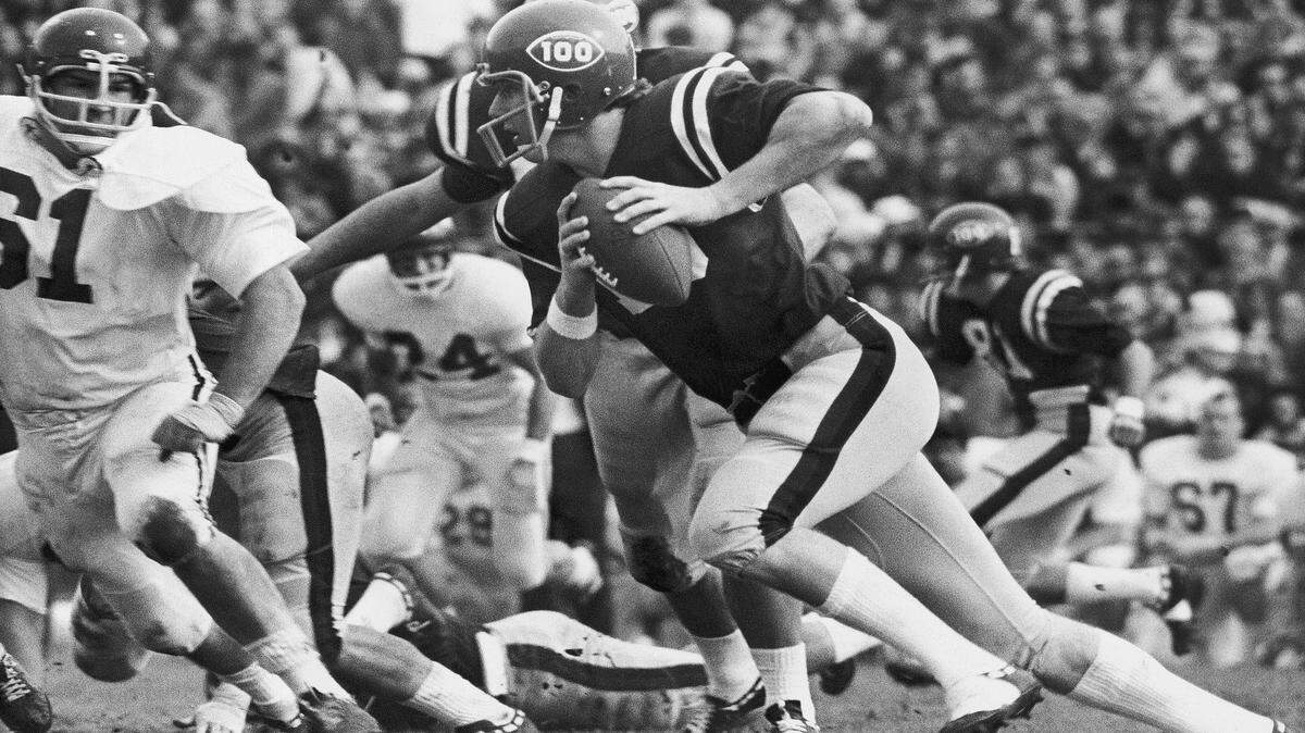 Ole Miss quarterback Archie Manning, who engineered two Rebel touchdowns against Arkansas in the first quarter of their Sugar Bowl contest in New Orleans, Jan. 1, 1970, sets out on a five yard gain early in the game. Arkansas' Dick Bumpas (61) is at left.