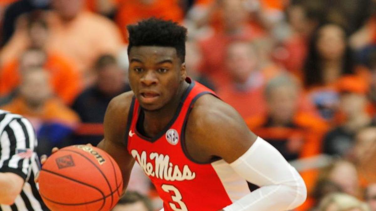 Terence Davis led Ole Miss past Syracuse 85-80 to reach the NIT quarterfinals.