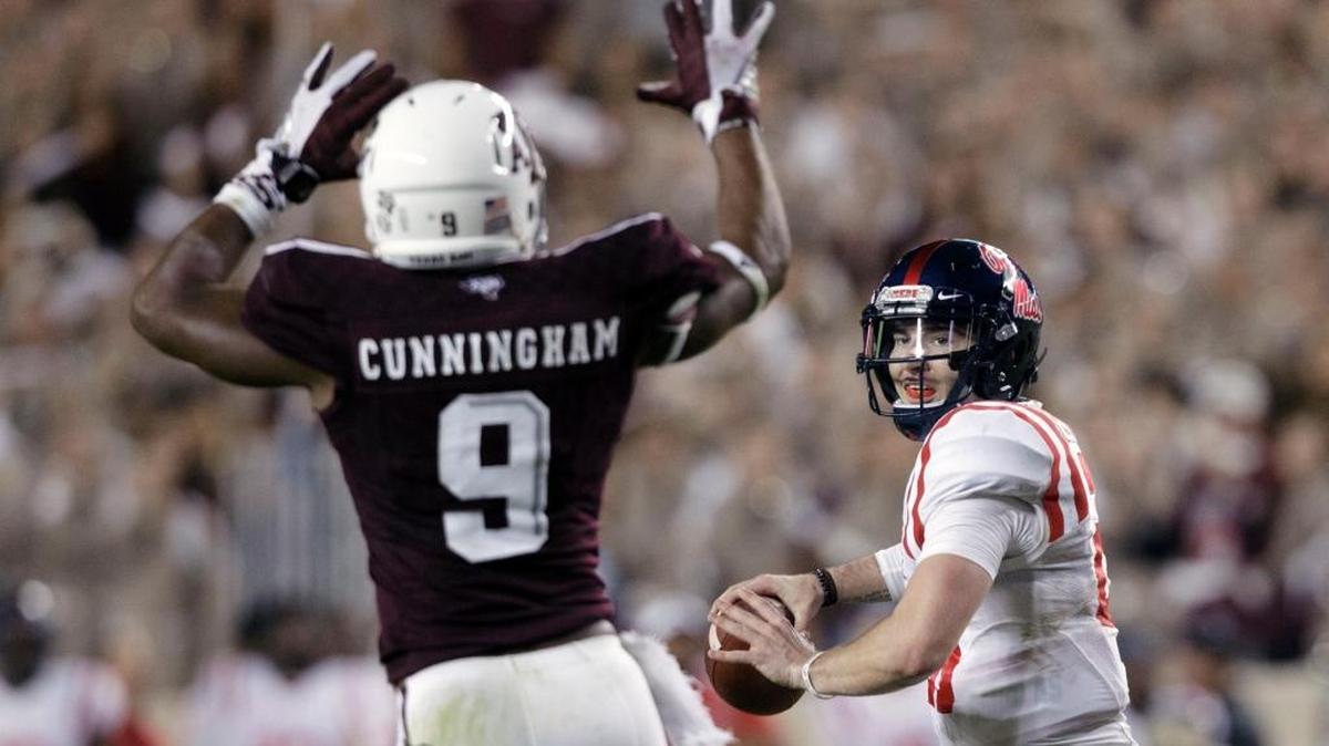 Ole Miss quarterback Shea Patterson (20) looks to pass against Texas A&M defensive lineman Qualen Cunningham (9). The Rebels travel to Vanderbilt on Saturday night.