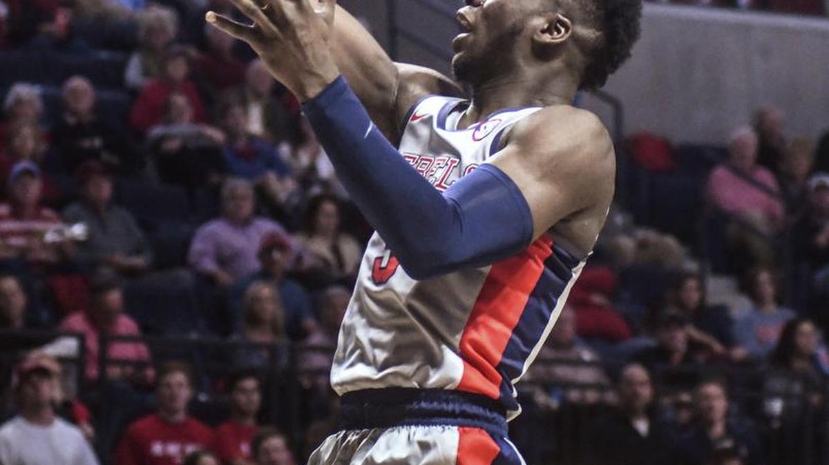 Ole Miss guard Terence Davis (3) shoots against Georgia guard Juwan Parker (3).