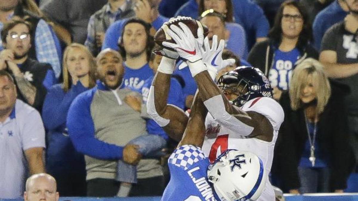 Ole Miss wide receiver D.K. Metcalf catches a winning touchdown over Kentucky cornerback Lonnie Johnson on the final play. Metcalf apologized Sunday for his controversial touchdown celebration in the Egg Bowl.