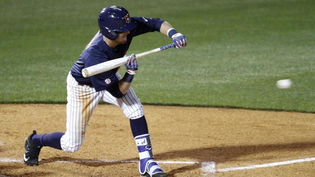 Ole Miss shortstop Kyle Watson tries to lay down a bunt against Nicholls at MGM Park, Tuesday, March 14, 2017.