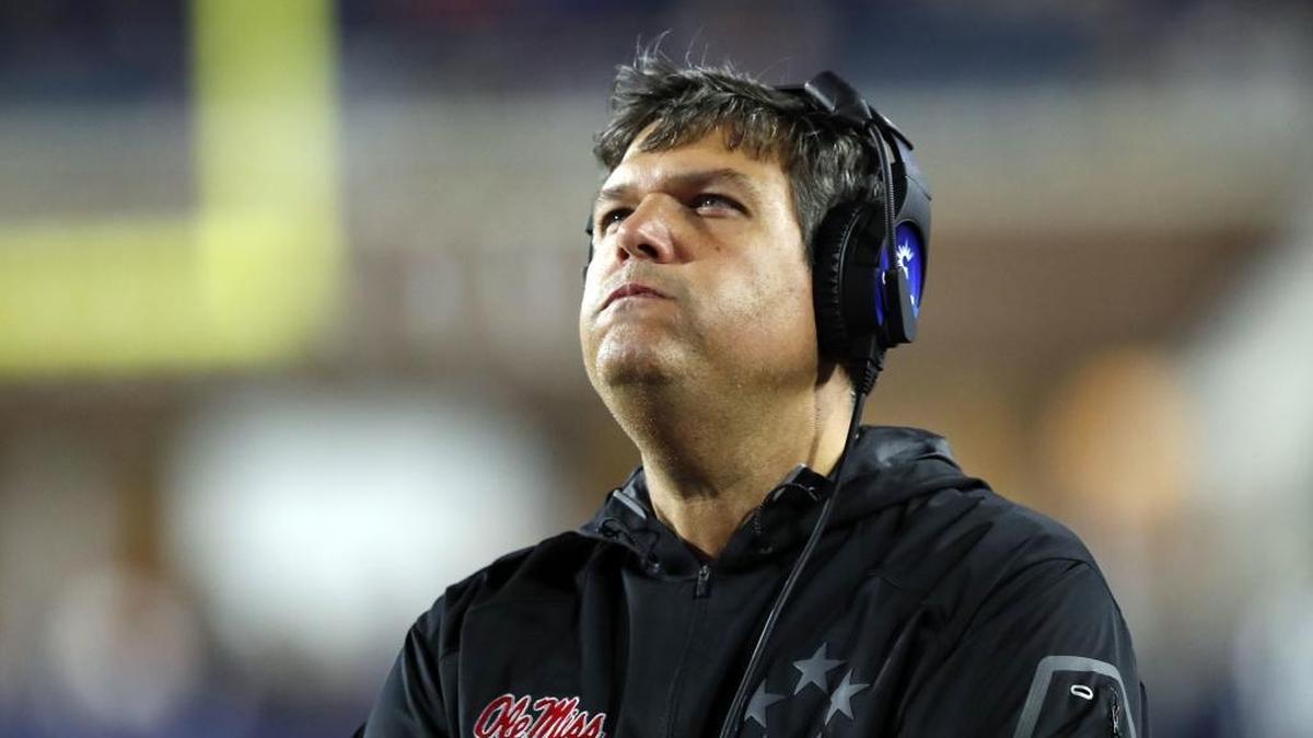 In this Nov. 18, 2017, file photo, Ole Miss coach Matt Luke looks at the replay of a play on the video board. Ole Miss learned the NCAA’s ruling and will have a two-year bowl ban, among other sanctions.