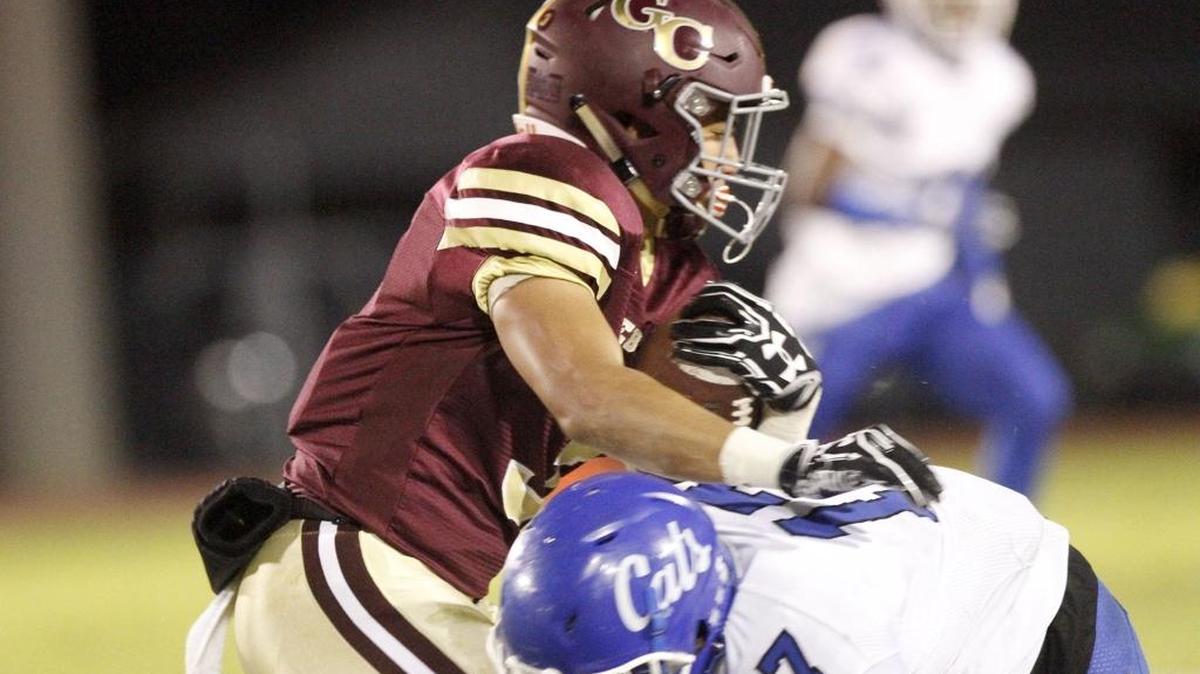 Meridian's Santrell Lathem, a Southern Miss commit, brings down George County receiver Tyrese Fryfogle at 6A playoff game in Lucedale on Nov. 11.