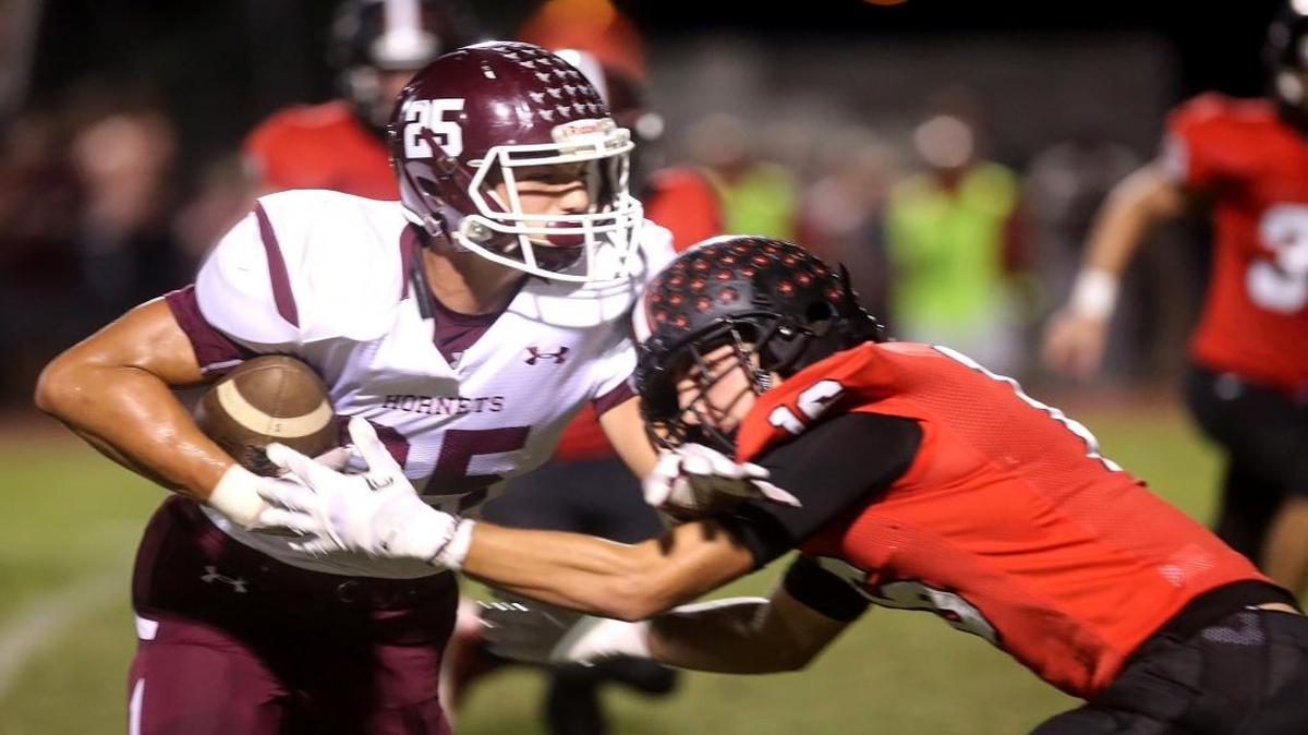 East Central tight end Brad Cumbest runs the ball while St. Stanislaus' Corbin Blanchard pushes him towards the sidelines on Oct.14, 2016, in Bay St. Louis.