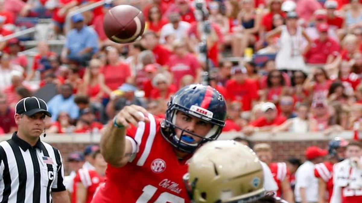Ole Miss quarterback Chad Kelly (10) throws a 6-yard touchdown pass to wide receiver Quincy Adeboyejo (8) in Oxford, Miss., Saturday.
