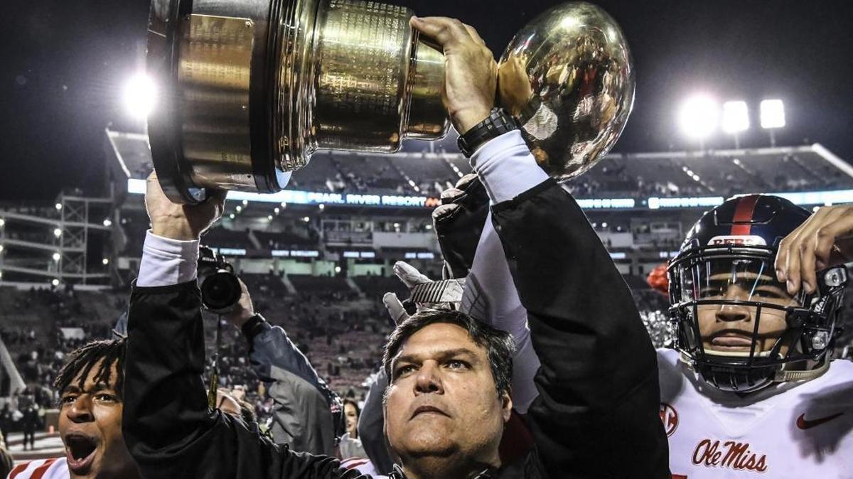 Ole Miss has named Matt Luke its permament head coach Sunday. Luke holds the Golden Egg trophy following the Rebels’ 31-28 win over Mississippi State.