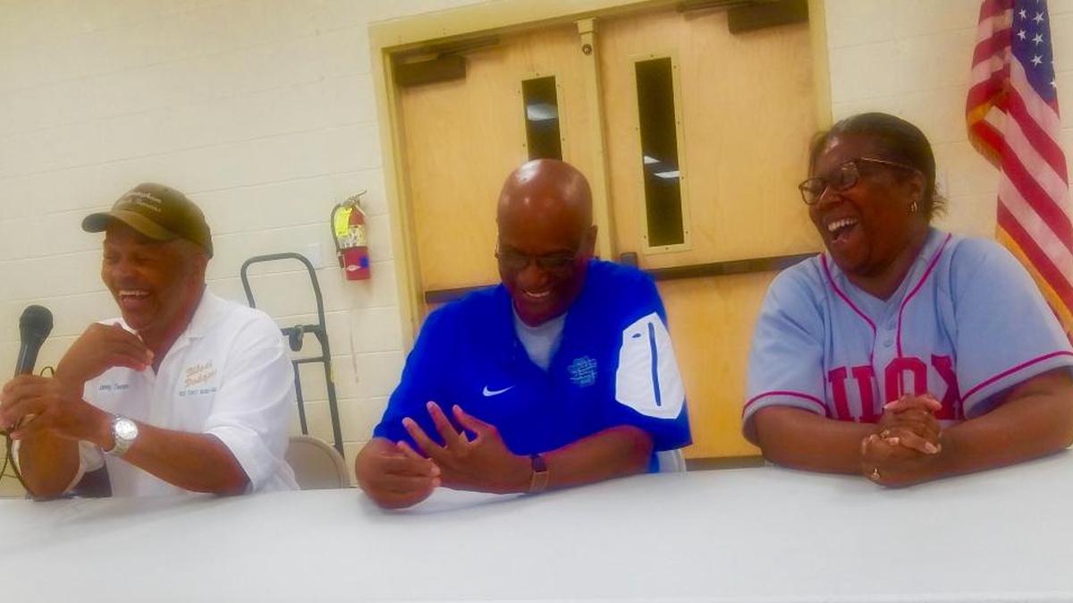 Former Biloxi Dodgers Johnny Thompson, far left, and Gerald Jacobs, center, share a laugh with Kay Horne, daughter of Biloxi Dodgers founder and owner, Rosell Horne, during a ceremony honoring the 70th anniversary of Jackie Robinson breaking the color barrier.
