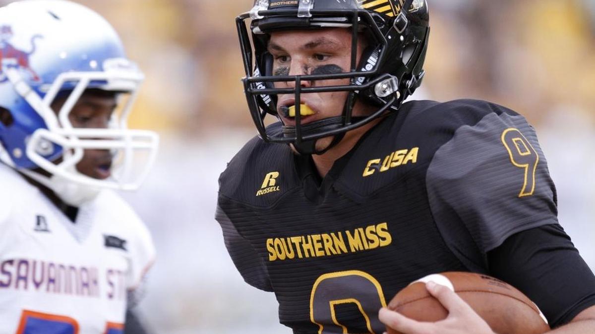 Southern Miss quarterback Nick Mullens scores the first Golden Eagle touchdown against Savannah State on Sept. 10 in Hattiesburg.