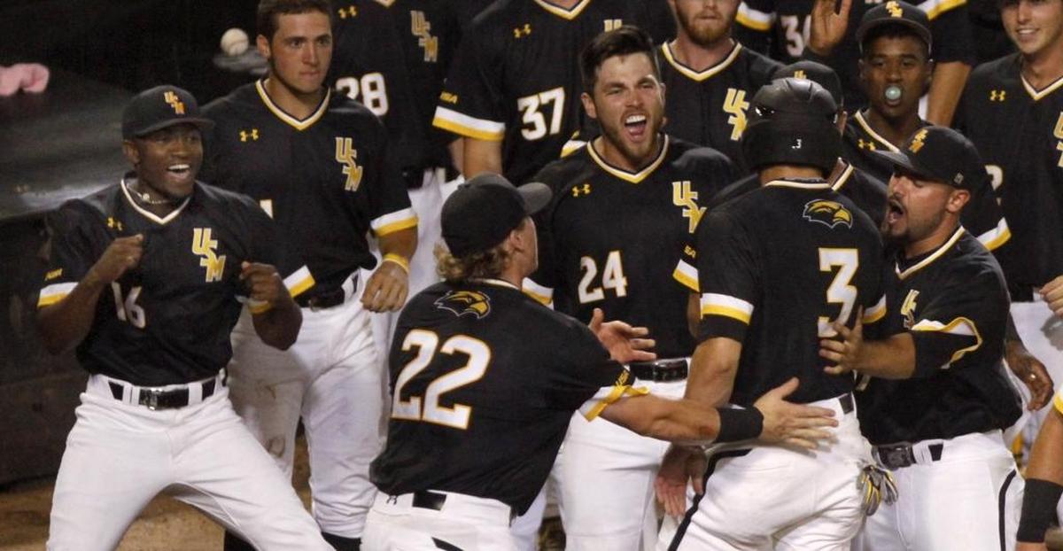 J.C. Keys, Dylan Burdeaux and the Southern Miss dugout erupt with joy after Daniel Keating scored against Mississippi State during the Hattiesburg Regional Tournament. Photographer’s comment: I thought this was a good image of Southern Miss players celebrating runs scored during the Hattiesburg Regional Tournament. In sports photography, one should always look for the action and reaction.