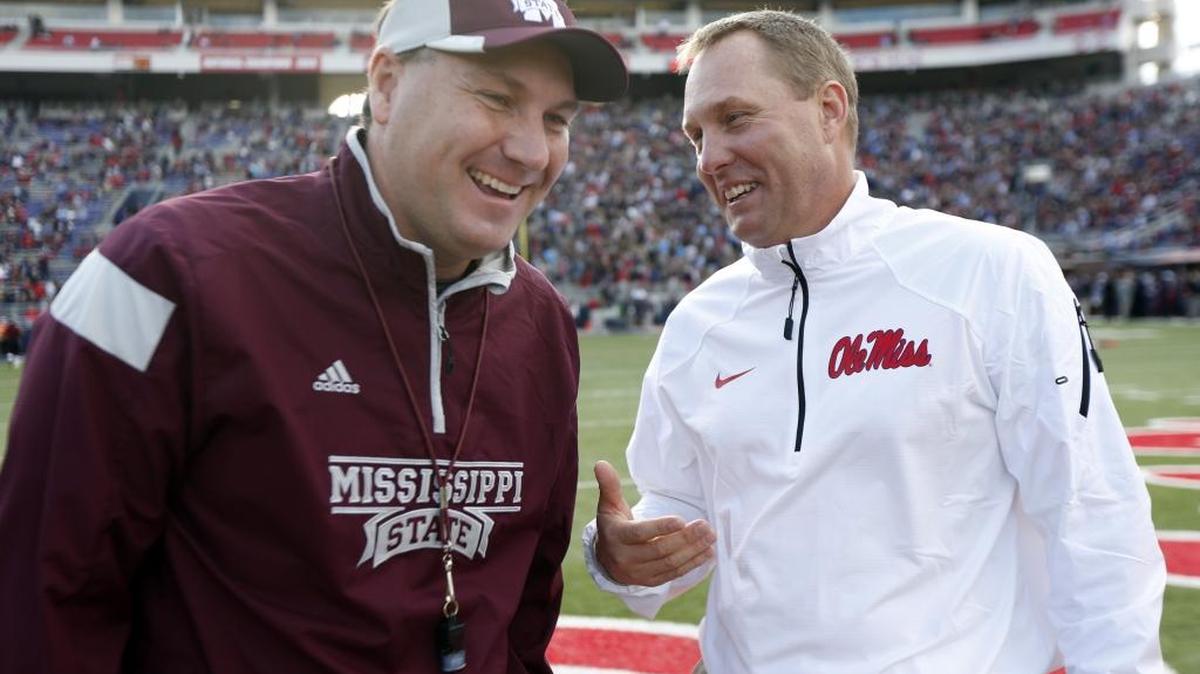 Mississippi State football coach Dan Mullen, leftand Ole Miss football coach Hugh Freeze will play in Thursday’s C-Spire Pro-Am Golf tournament.
