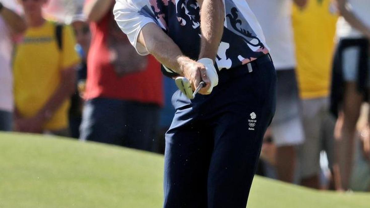 Justin Rose chips on the 12th hole during the final round of the men's golf event at the 2016 Summer Olympics in Rio de Janeiro, Brazil, Sunday.