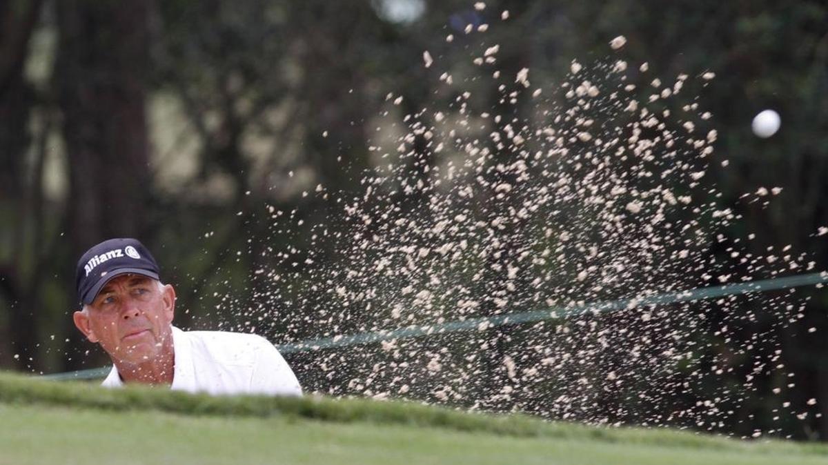 Tom Lehman chips out of the bunker on Hole No. 4 during at Fallen Oak on March 30, 2017.