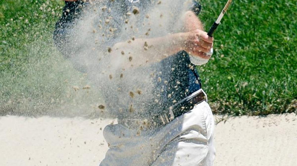 In this June 15, 2011, file photo, Geoffrey Sisk hits to the 11th green during a practice round for the U.S. Open Championship golf tournament in Bethesda, Md.